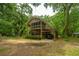 Two-story home with a screened porch, carport, and fenced yard at 8389 Chisolm Plantation Rd, Edisto Island, SC 29438
