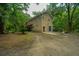 Charming two-story home nestled among trees with a patio and fenced yard at 8389 Chisolm Plantation Rd, Edisto Island, SC 29438