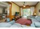 Cozy den with plush seating, and patio access through sliding doors at 8389 Chisolm Plantation Rd, Edisto Island, SC 29438