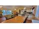Open-concept living area with kitchen, dining, and sitting area at 8389 Chisolm Plantation Rd, Edisto Island, SC 29438