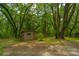 Storage shed with lattice windows in a wooded area at 8389 Chisolm Plantation Rd, Edisto Island, SC 29438
