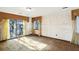 Empty bedroom with sliding glass doors to balcony, light-yellow curtains, and carpeted floor at 9875 Jamison Rd, Summerville, SC 29485