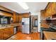 Kitchen with wood cabinets, stainless steel appliances, and tile flooring at 9875 Jamison Rd, Summerville, SC 29485