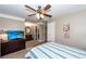 Main bedroom showcasing wooden furniture, ceiling fan, and an ensuite bathroom at 107 Deer Run Ct, Goose Creek, SC 29445