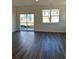 Spacious living room with wood-look flooring and sliding glass doors at 1101 Scarlett Maple St, Summerville, SC 29486