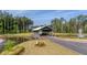 Scenic community entrance with covered bridge, pond, and water features at 1127 Ark Shell Dr, Summerville, SC 29485