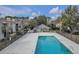 Community pool surrounded by a fence and lounge chairs at 1402 Camp Rd # 3A, Charleston, SC 29412