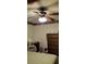 Bedroom with ceiling fan, wooden dresser, and light green bedding at 141 Wintergreen Rd, Walterboro, SC 29488
