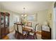 Elegant dining room with hardwood floors, wooden table, and china cabinet at 1434 River Front Dr, Charleston, SC 29407