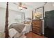 Cozy main bedroom with four-poster bed, dresser, and safe at 1443 Oaklanding Road, Mount Pleasant, SC 29464