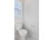 White bathroom with toilet and marble tile floor at 1445 Clay Field Trl, Summerville, SC 29485