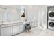 Bathroom with double vanity, marble floors, and laundry at 1445 Clay Field Trl, Summerville, SC 29485