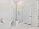 Modern bathroom with glass shower and soaking tub at 1445 Clay Field Trl, Summerville, SC 29485