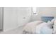 Cozy bedroom with white walls, plush carpet, and a window offering natural light at 1445 Clay Field Trl, Summerville, SC 29485