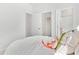 Bedroom featuring white walls, wire shelving, and a door leading to the en-suite bathroom at 1445 Clay Field Trl, Summerville, SC 29485