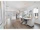 Dining area with a wooden table, wicker chairs, and an open view of the kitchen at 1445 Clay Field Trl, Summerville, SC 29485