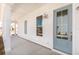 Covered front porch with a light blue door and white siding at 1445 Clay Field Trl, Summerville, SC 29485