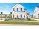 Front yard with a landscaped garden, walkway, and palm trees at 1445 Clay Field Trl, Summerville, SC 29485