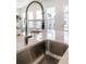 Modern kitchen sink with stainless steel faucet and white countertops at 1445 Clay Field Trl, Summerville, SC 29485
