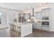 Modern kitchen with gray cabinets, island with seating, and stainless steel appliances at 1445 Clay Field Trl, Summerville, SC 29485