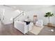 Living room with white furniture and wood floors at 1445 Clay Field Trl, Summerville, SC 29485