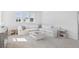 Bright loft space with white sectional sofa and decorative accents at 1445 Clay Field Trl, Summerville, SC 29485