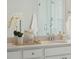 Bathroom vanity with quartz countertop and modern fixtures at 202 Denham St, Summerville, SC 29486