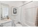 Simple bathroom with tub shower combo and white vanity at 202 Denham St, Summerville, SC 29486