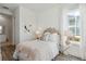 bedroom with patterned wallpaper and soft pink accents at 202 Denham St, Summerville, SC 29486