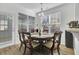 Breakfast area with round table, four chairs, and large windows at 2426 Stadium Dr, North Charleston, SC 29406