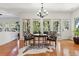 Dining area with zebra print chairs, round table, and large windows at 2457 Vaucluse Rd, Charleston, SC 29414