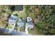 An aerial view showcasing homes with pools and lush green yards at 260 Carolinian Dr, Summerville, SC 29485