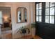 View of entryway with mirror, entry table and front door, with view to bedroom at 260 Carolinian Dr, Summerville, SC 29485