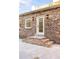 View of a brick house's exterior, steps, doorway, and outdoor lighting at 278 Meeting St, Charleston, SC 29401