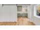 View of the kitchen with green cabinets, stainless steel appliances, and hardwood floors at 278 Meeting St, Charleston, SC 29401