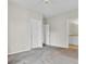 Spacious, empty bedroom with neutral carpet and white doors to bathroom and closet at 280 Seven Farms Dr # 203, Charleston, SC 29492