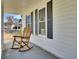 Covered front porch with a rocking chair, perfect for relaxation at 3009 Woodington Pl, Goose Creek, SC 29445