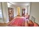 Finished basement space with wood floors, antique furniture, a red rug, and built-in shelving at 359 Clayton Dr, Charleston, SC 29414