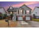 Charming two-story home with a brick and siding facade, attached garage, and front porch at 359 Clayton Dr, Charleston, SC 29414