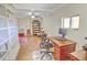 Home office in the basement, featuring built-in shelving, hardwood floors, and a workspace at 359 Clayton Dr, Charleston, SC 29414