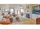 Cozy living room with hardwood floors, fireplace, built-in bookshelves, and large windows at 359 Clayton Dr, Charleston, SC 29414