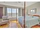 Spacious bedroom with hardwood floors, large windows, and a four-poster bed at 359 Clayton Dr, Charleston, SC 29414