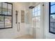 Modern bathroom with walk-in shower, double vanity, and contemporary fixtures at 48 Grove St, Charleston, SC 29403