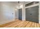 Empty bedroom with wood floors, closet, and access to another room at 48 Grove St, Charleston, SC 29403