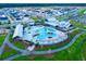 Aerial view of a community pool, clubhouse, and surrounding homes at 517 Rustling Tree Ct, Summerville, SC 29486