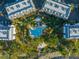 An aerial view of the community pool, with surrounding buildings and parking at 7600 Palmetto Dr, Isle of Palms, SC 29451