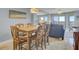 Dining area with wooden table and chairs, adjacent to living space at 7600 Palmetto Dr, Isle of Palms, SC 29451