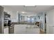 Open kitchen with breakfast bar and ocean views at 7600 Palmetto Dr, Isle of Palms, SC 29451