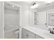 Bathroom with white vanity, mirror, and shower-tub combo at 771 Opal Wing St, Moncks Corner, SC 29461