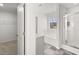 View of bathroom with soaking tub, glass shower, and walk-in closet at 773 Opal Wing St, Moncks Corner, SC 29461